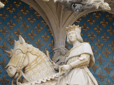 Statue of Louis XII King of France, with horse and fleurs de lys, at the Royal Wing
